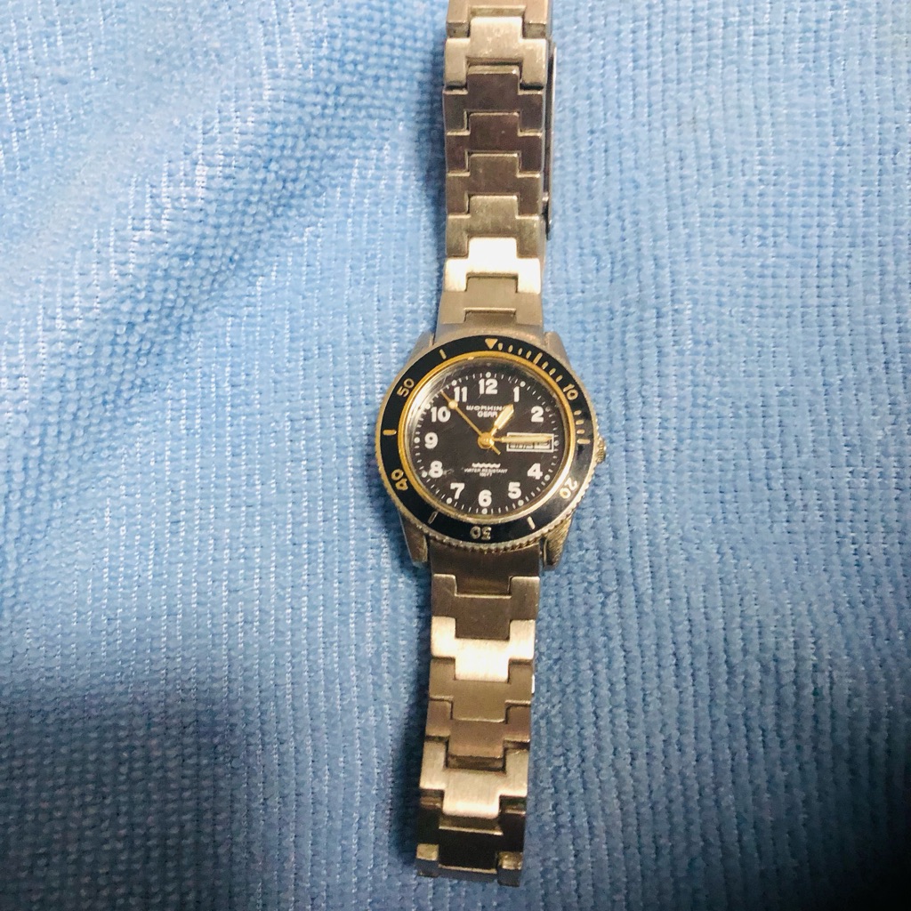 Silver And Black Watch With Gold Accents Silver And Black Watch With Gold Accents